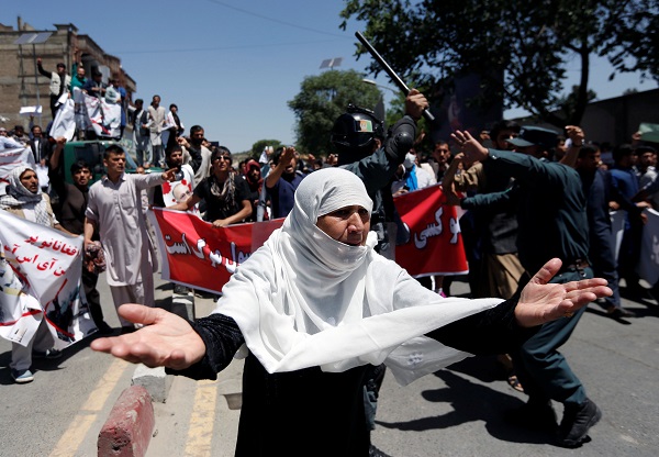 An Afghan woman chants slogans during a protest in Kabul, Afghanistan.