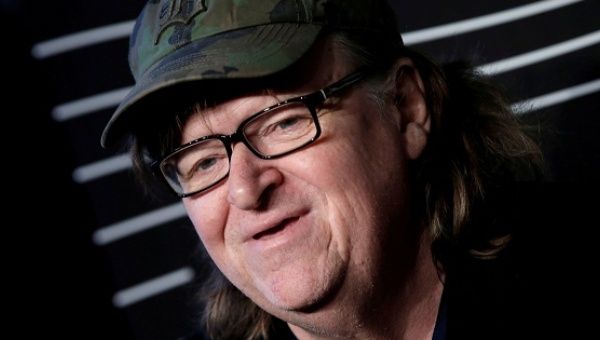Filmmaker Michael Moore poses as he arrives for the 20th Annual Webby Awards in Manhattan, New York, U.S., on May 16, 2016