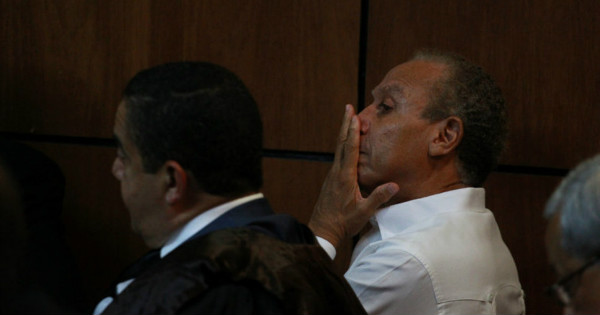 Angel Rondon (R), Odebrecht's commercial representative in the Dominican Republic, looks on to the judge's ruling.