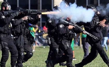 Riot police officers clash with demonstrators during a protest against right-wing Brazilian President Michel Temer.