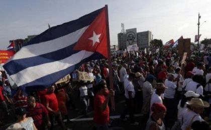 A man waves a Cuban flag in Havana's Revolution Square during the May Day parade May 1.