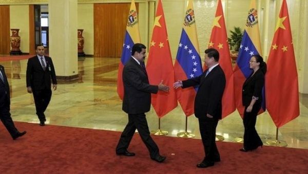China and Venezuela have been historic economic allies. Venezuelan President Maduro (L) meets with President Xi Jinping (R) of China are seen meeting in 2015.