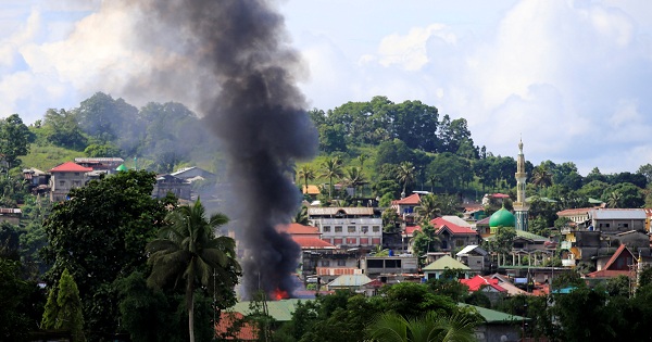 Smoke rises as government troops continue their assault on insurgents in Marawi, southern Philippines, June 10, 2017