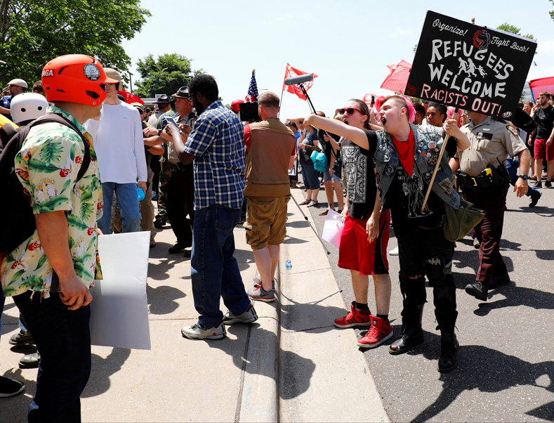 Anti-Muslim protesters scuffle with counter demonstrators and members of the Minnesota State Patrol at the state capitol in St. Paul, Minnesota, U.S. June 10, 2017.