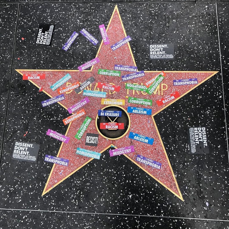 President Donald Trump's Hollywood star is covered in protest slogans for the Los Angeles Pride march.