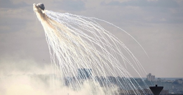Photo showing white phosphorous, with its characteristic white trailed showers.