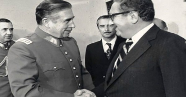 Chilean dictator Augusto Pinochet (L) greets U.S Secretary of State Henry Kissinger (R) in 1976 as Operation Condor was in full swing.