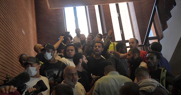 Demonstrators enter Kensington Town Hall, during a protest following the fire that destroyed The Grenfell Tower block, in West London, UK - June 16, 2017