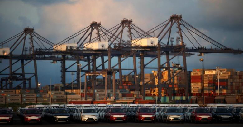 Cars and containers are seen in the port of Lazaro Cardenas November 20, 2013.