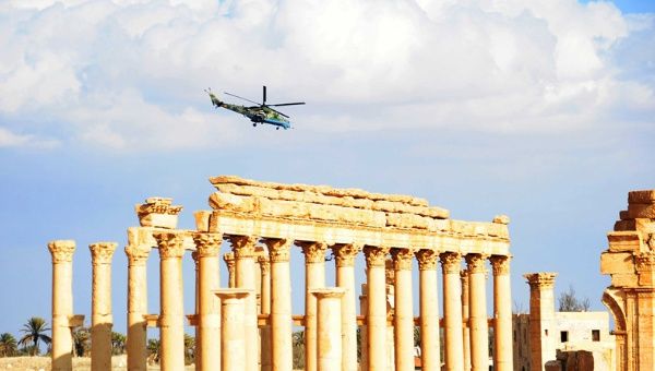 A Russian helicopter hovers over the ancient city of Palmyra, central Syria, on March 4, 2017.