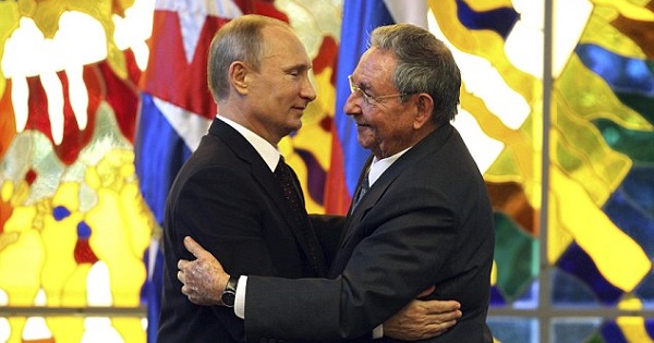 Russia's Vladimir Putin embraces Cuba's Raul Castro in Havana.
