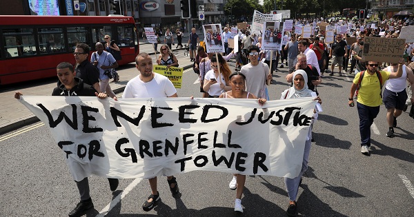 Demonstrators march during a protest about the Grenfell Tower fire, in London, Britain, on June 21, 2017.
