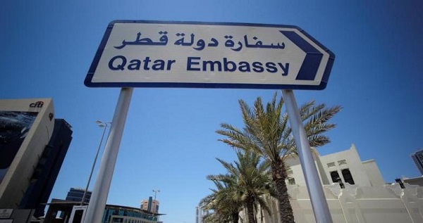 A sign indicating a route to Qatar embassy is seen in Manama, Bahrain.