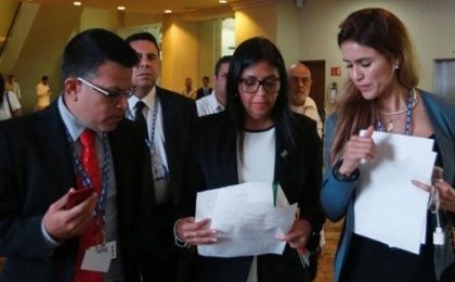 Venezuelan Foreign Minister Delcy Rodriguez (C) check some documents with the delegation after a meeting with foreign ministers ahead of the OAS 47th General Assembly in Cancun, Mexico, June 19, 2017.