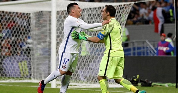 Chile’s Claudio Bravo (L) celebrates with Gary Medel after saving three penalty shots against Portugal during the FIFA Confederations Cup Russia 2017.
