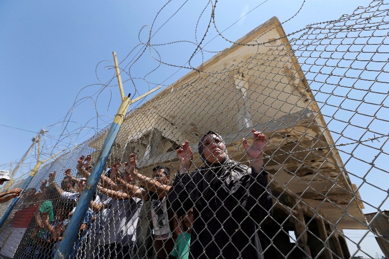 Meanwhile, Palestinians gather in front of the gate of Rafah border crossing between Egypt and Gaza during a protest against the blockade calling for reopening of the crossing, in the southern Gaza Strip July 3, 2017.