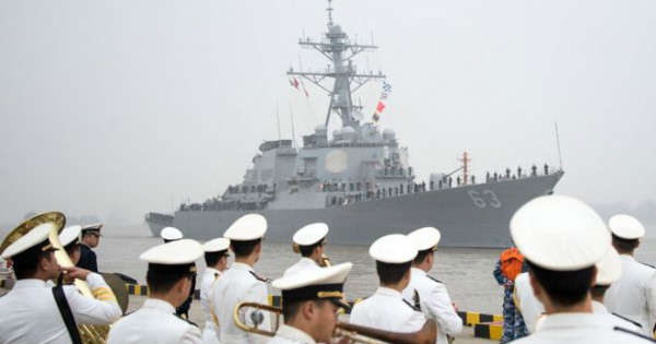 Pictured in the background is the USS Stetham arriving in Shanghai in 2015.