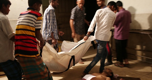 People line up the bodies of workers who died in a boiler blast at a garment factory in Gazipur, Bangladesh