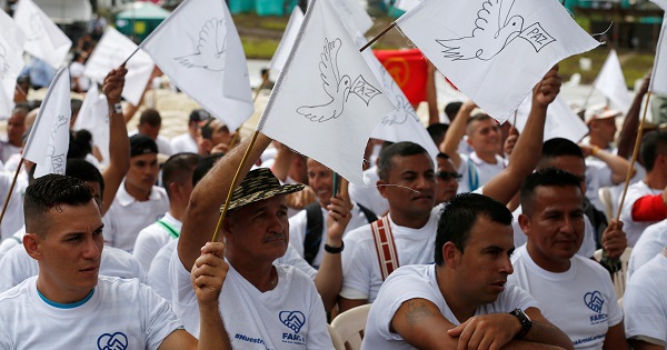 FARC former rebels wave peace flags during the final act of abandonment of arms in Mesetas, Colombia.