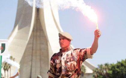 An Algerian parachutist holds a torch during a demonstration to mark Algeria's Independence Day in Algiers July 5, 2017.