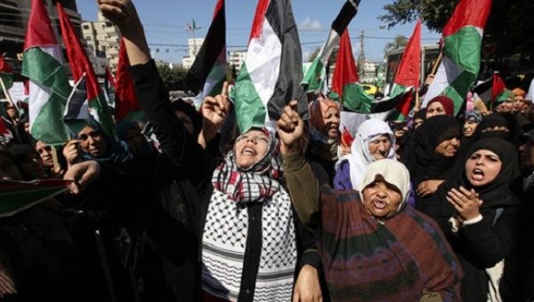 Palestinian women attend a rally calling for an end to Palestinian divisions to mark International Women's Day, in Gaza City, Gaza, March 8, 2011.  