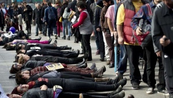 In Santiago, Chile, protesters lay down to represent victims of femicide in June 2015