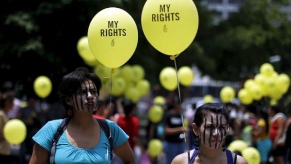 Women take part in a demonstration against anti-abortion laws in San Salvador on April 22, 2015. 