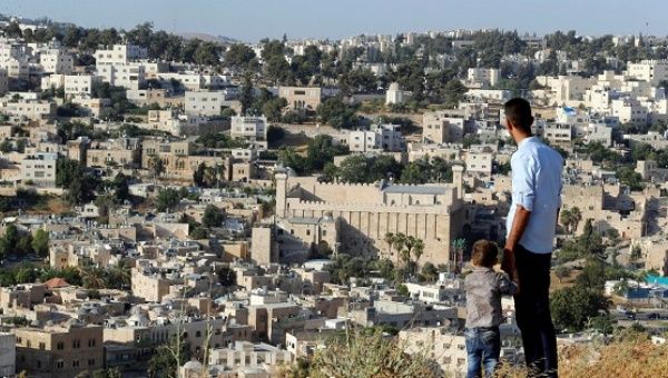 A general view as Palestinians look at the West Bank city of Hebron July 7, 2017. 
