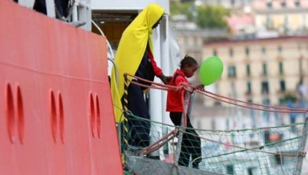 A girl disembarks from the Aquarius rescue ship run by NGO S.O.S. Mediterranee and Medecins Sans Frontieres in the Italian port of Salerno on May 26 2017