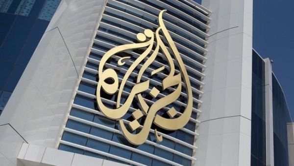 The logo of Al Jazeera Media Network is seen on its headquarters in Doha, Qatar, on June 8, 2017. 