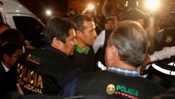 Former Peruvian president Humala is escorted by police.