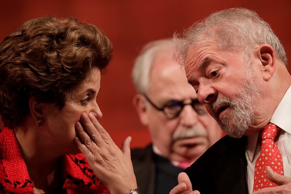 Former Brazilian President Dilma Rousseff speaks to Luiz Inacio Lula da Silva during the inauguration of the new National Directory of the Workers' Party, in Brasilia, Brazil July 5, 2017.