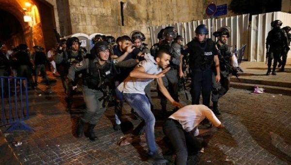 Israeli police attack Palestinian protesters outside Lion's Gate, July 18, 2017.