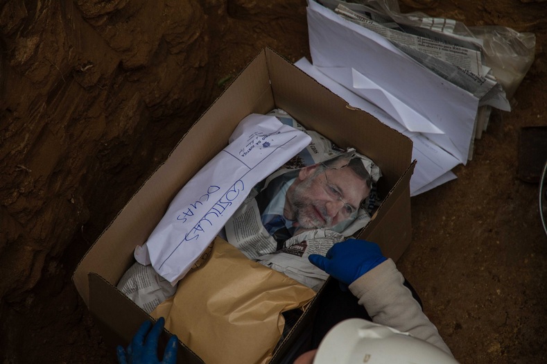 Bones packed and wrapped with newspapers bearing the face of Spanish PM Mariano Rajoy.