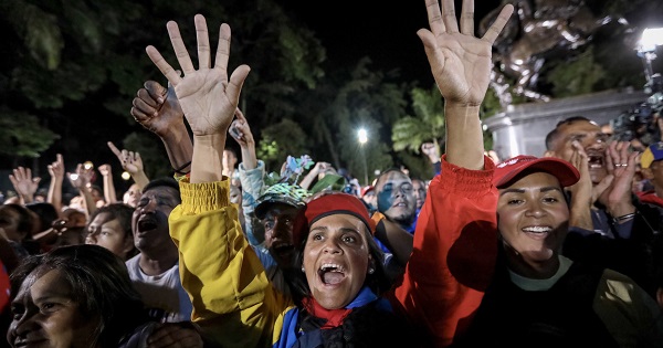Supporters of President Maduro celebrate the election results in Caracas