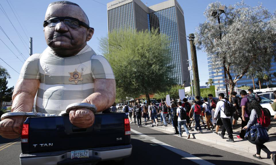 An effigy showing Maricopa County Sheriff Joe Arpaio in handcuffs is on parade at a protest in downtown Phoenix on November 8, 2016.