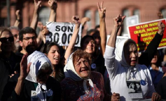 Members of the human rights group Madres de Plaza de Mayo commemorate the 40th anniversary of their first march to demand justice for their children, who went missing during Argentina's 1976-1983 military dictatorship, in front of the Casa Rosada Presidential Palace in Buenos Aires, Argentina.