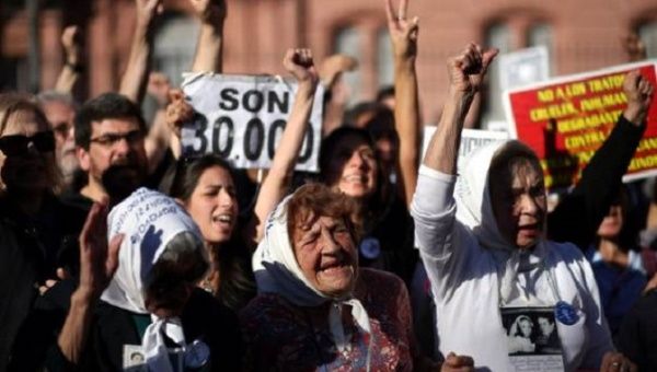 Members of the human rights group Madres de Plaza de Mayo commemorate the 40th anniversary of their first march to demand justice for their children, who went missing during Argentina's 1976-1983 military dictatorship, in front of the Casa Rosada Presidential Palace in Buenos Aires, Argentina.