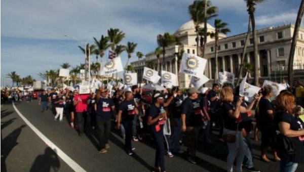 Members of Puerto Rico's labor unions protest against the island's US$74 billion dollar debt. 
