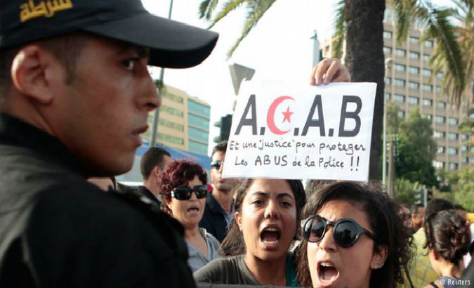 Tunisian activists protest in support of a woman who was allegedly raped by police and is facing indecency charges.