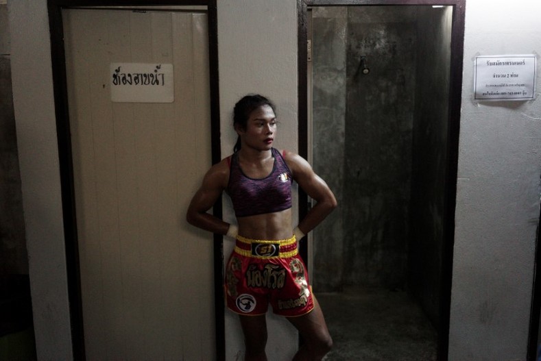 Rose in a quiet moment before her match at the Rajadamnern Stadium in Bangkok, Thailand