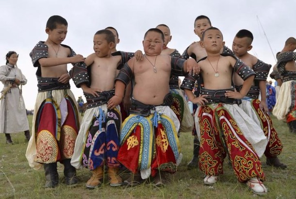 Young wrestlers pose during a Nadam Festival.  FILE