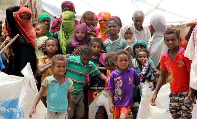 Displaced Yemenis gather outside makeshift shelters,  just a small part of the three million total according to U.N. figures.