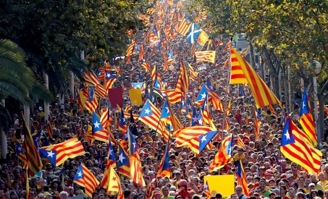 People hold Catalan separatist flags known as 