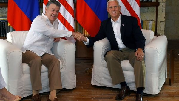 Colombia's President Juan Manuel Santos greets U.S. Vice President Mike Pence after his arrival in Cartagena, Colombia, Aug. 13, 2017. 