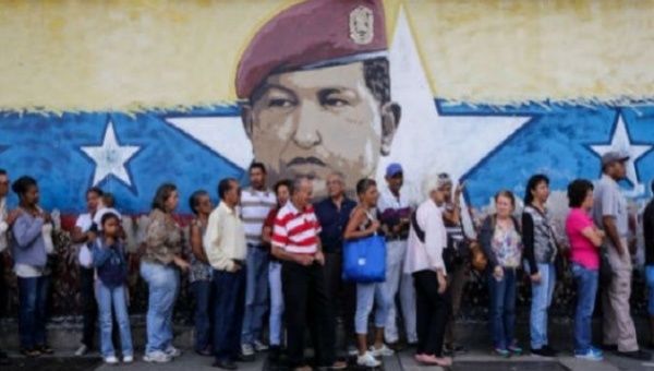 Voters line up to cast their ballot in Venezuela's dry run vote ahead of the National Constituent Assembly, July, 16, 2017.