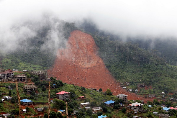 A gash remains where part of the hill that collapsed in the mountain town of Regent, that killed hundreds in Sierra Leone