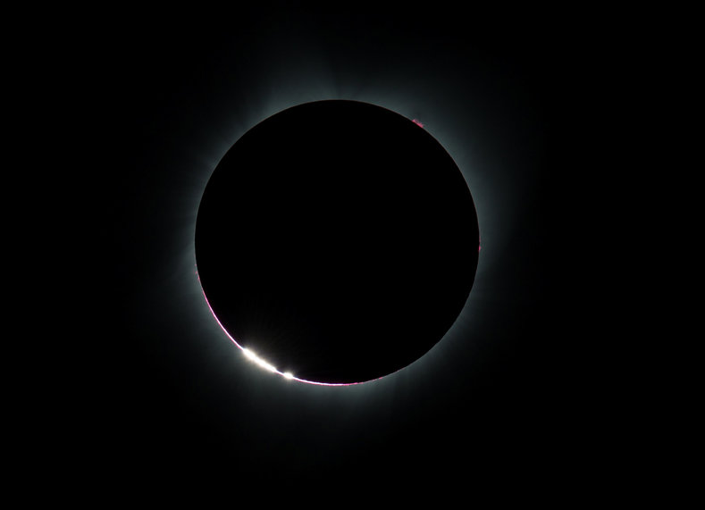 The Bailey Beads or Diamond Rings effect caused by the moon in front of the sun during the eclipse. This image was taken over Madras Oregon