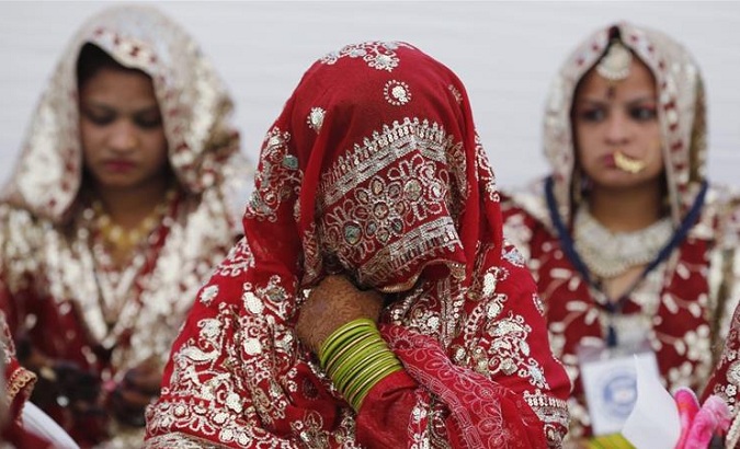 Muslim brides wait for the start of a mass marriage ceremony in Ahmedabad, India.