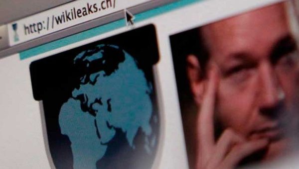 A screen shot of a web browser displaying the WikiLeaks website with a picture of its founder Julian Assange.